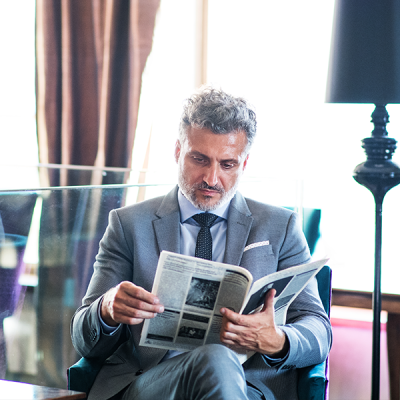 Man reading a newspaper.